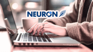 Hands typing on a laptop with the NeuronWriter logo overlaid